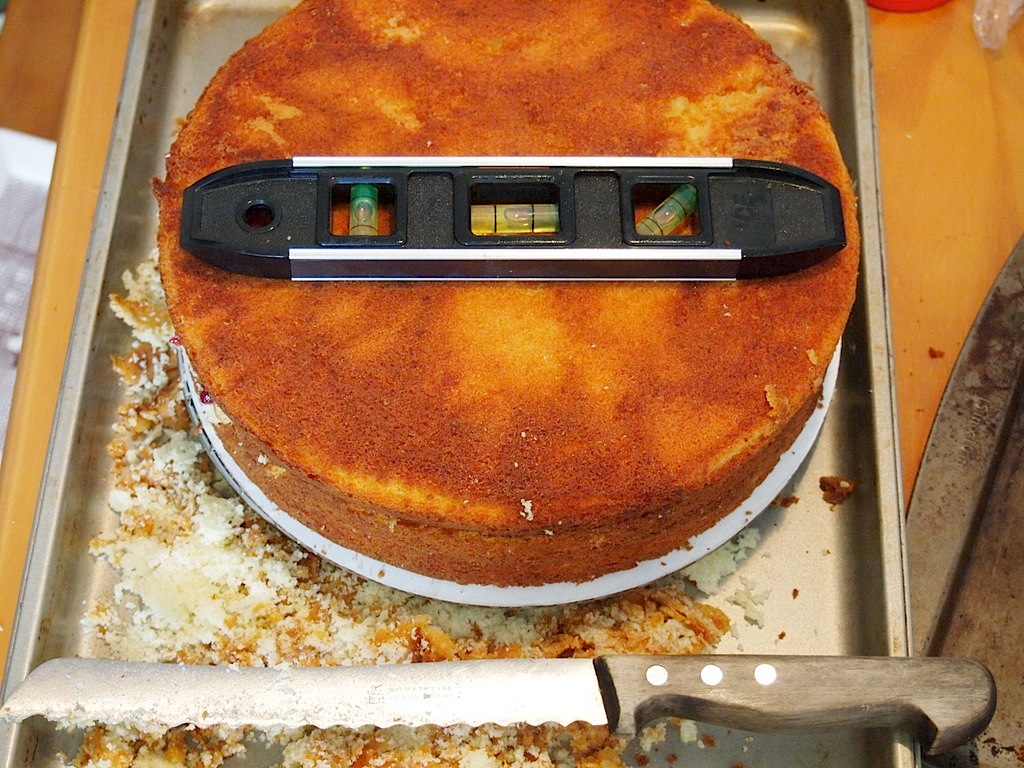 Keeping your layers level is absolutely essential; I shaved the tops off most of my cakes to get them nice and flat.