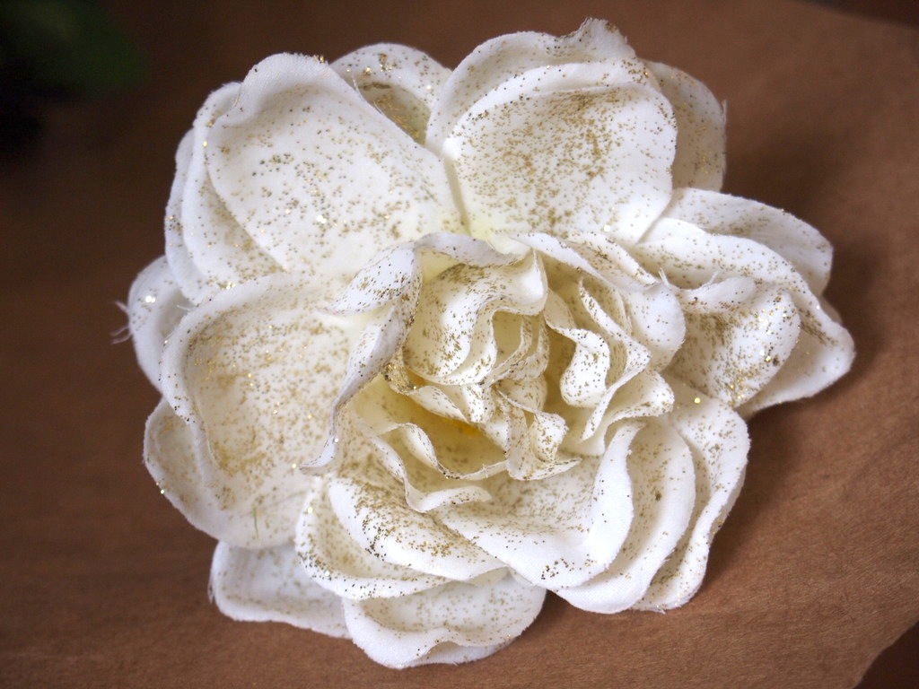 The reason I used silk flowers: I wanted to coat them in disco dust. I used a solution of water and Elmer's non-toxic to adhere the dust.